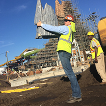 Two Team Members wearing safety vests at a Universal construction site