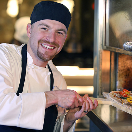 Culinary Team Member at pizza oven