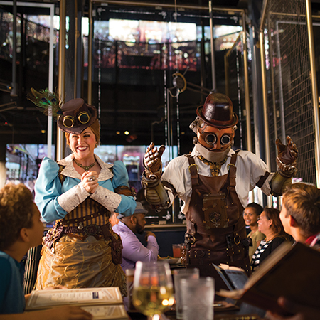 Steampunk-attired Team Members at the Toothsome Chocolate Emporium & Savory Feast Kitchen.