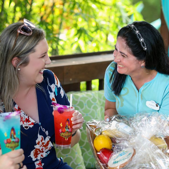 Universal Cabana Attendant Team Member Serving Guest at Volcano Bay