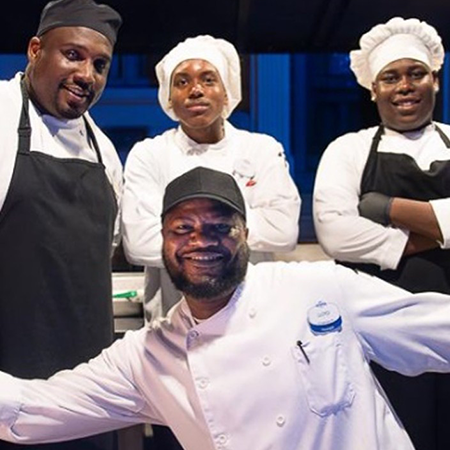uotmlife_1730676970_3493494017972469482_7540146675 crop Four chefs smiling at the camera